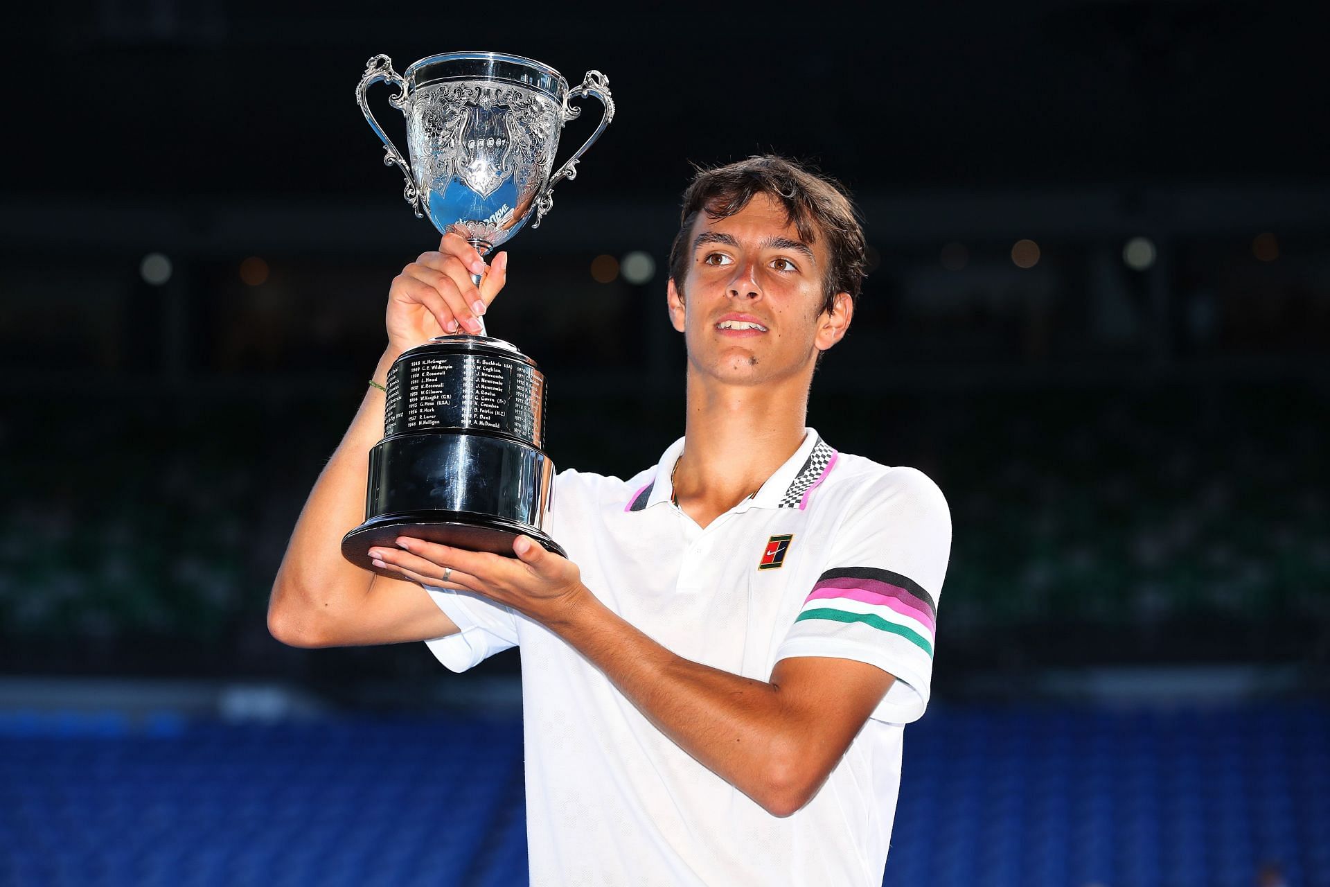 Lorenzo Mussetti with the 2019 Australian Open boys' singles trophy (IMAGE: GETTY)