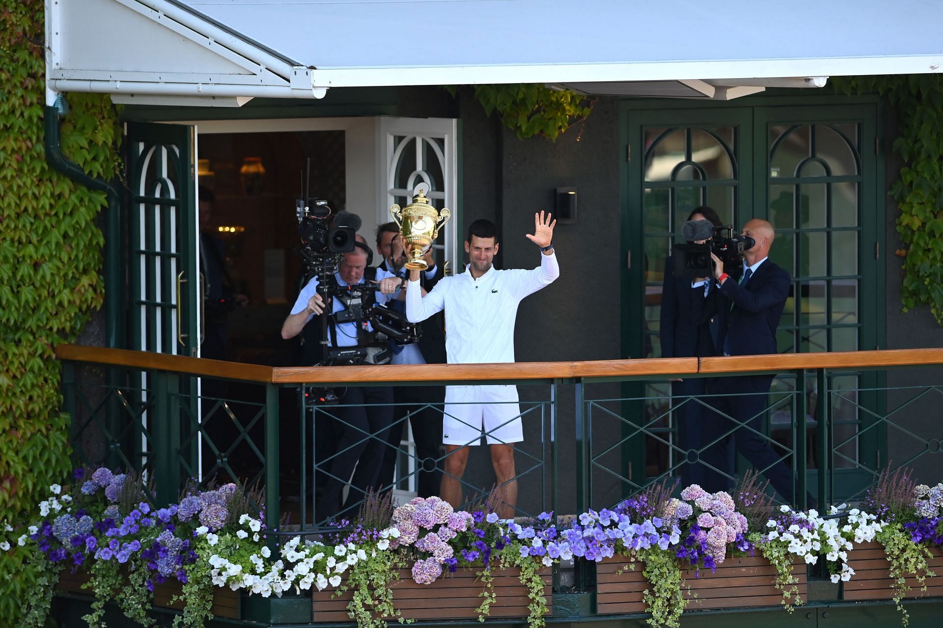 Novak Djokovic with the 2022 Wimbledon trophy.