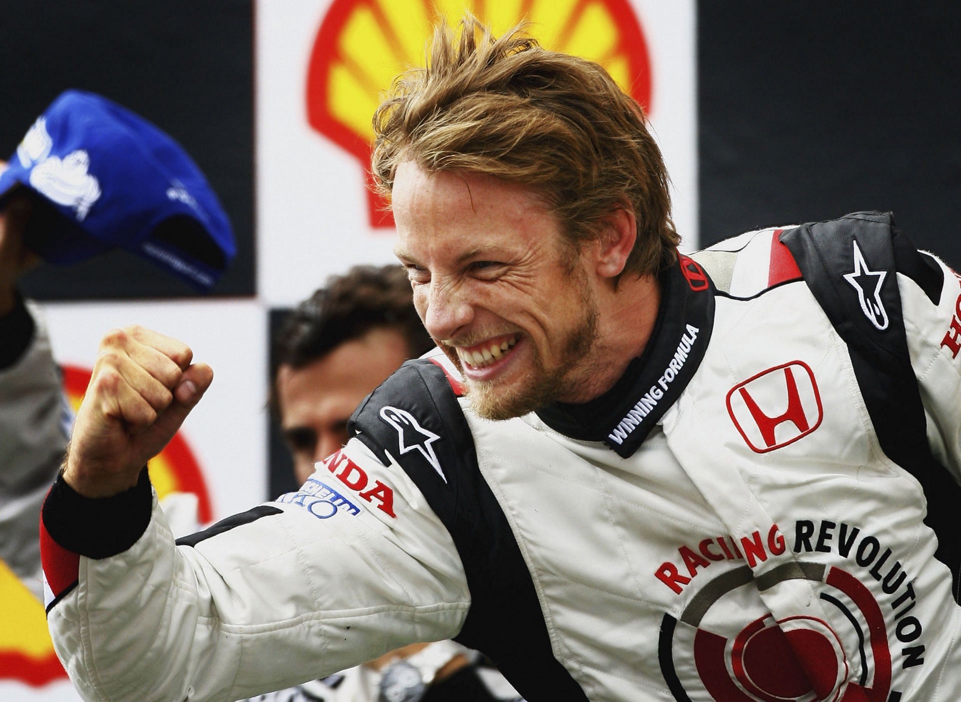 Jenson Button of Great Britain and Honda Racing celebrates victory on the podium - Getty Images