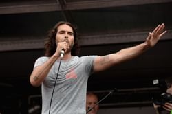 "Strong women worry you, don’t they" — Internet reacts to Russell Brand calling Joe Biden's endorsement of Kamala Harris an "extraordinary masquerade"