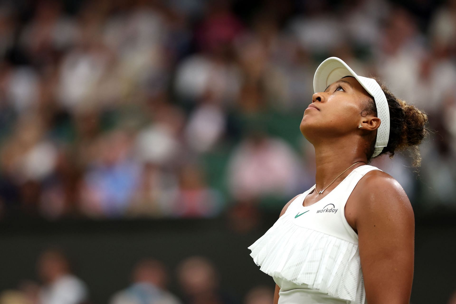 Naomi Osaka wears a dejected look during her second-round loss to Emma Navarro at the 2024 Wimbledon Championships