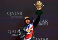 Race winner Lewis Hamilton of Great Britain and Mercedes celebrates on the podium during the F1 Grand Prix of Great Britain at Silverstone Circuit on July 07, 2024 in Northampton, England. (Photo by Mark Thompson/Getty Images)