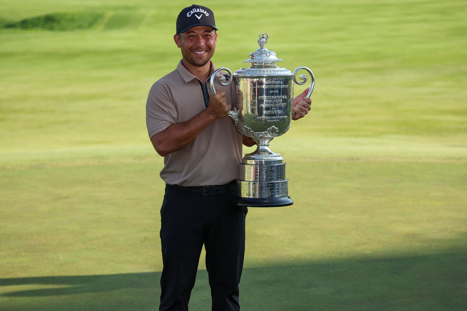 Xander Schauffle poses with the trophy after winning the 2024 PGA Championship (Image via Getty)