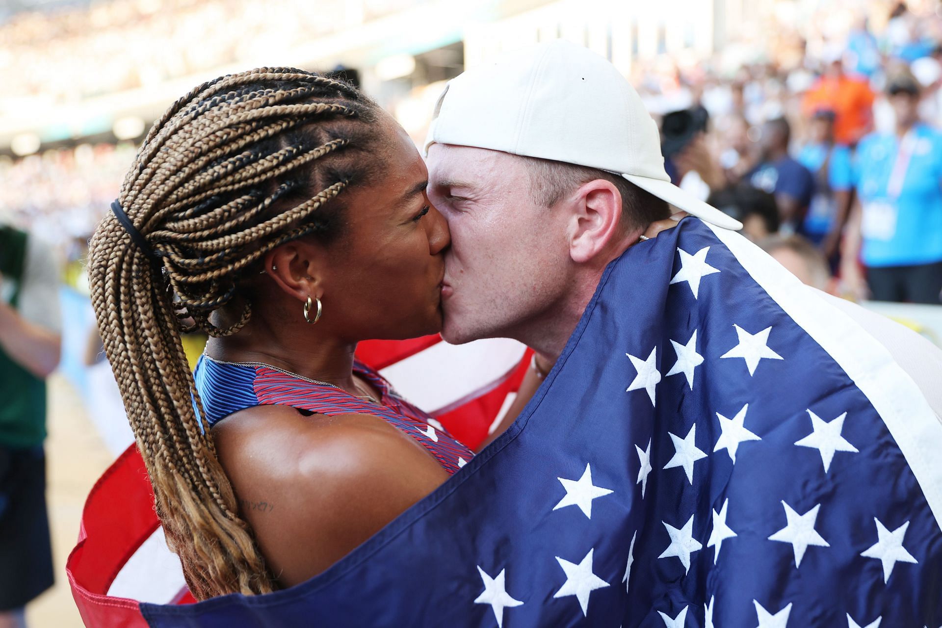 World Athletics Championships Budapest 2023-Tara Davis-Woodhall kisses husband after winning silver medal (Photo-Getty)