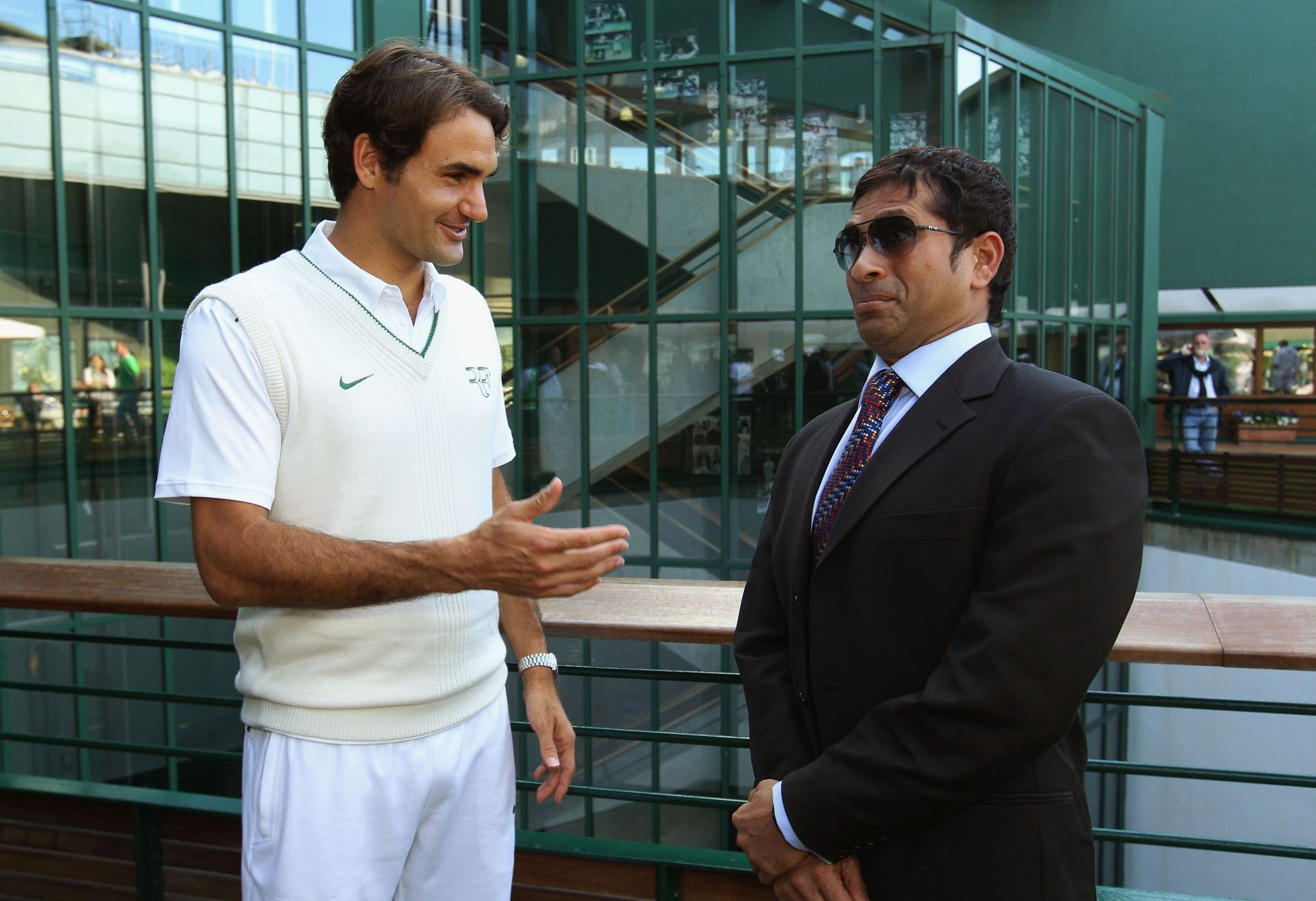 Roger Federer (L) and Sachin Tendulkar at the 2011 Wimbledon Championships