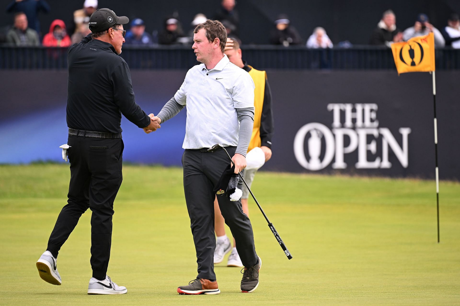 Robert MacIntyre and Phil Mickelson greet each other after completing the 152nd Open (Image via Getty)