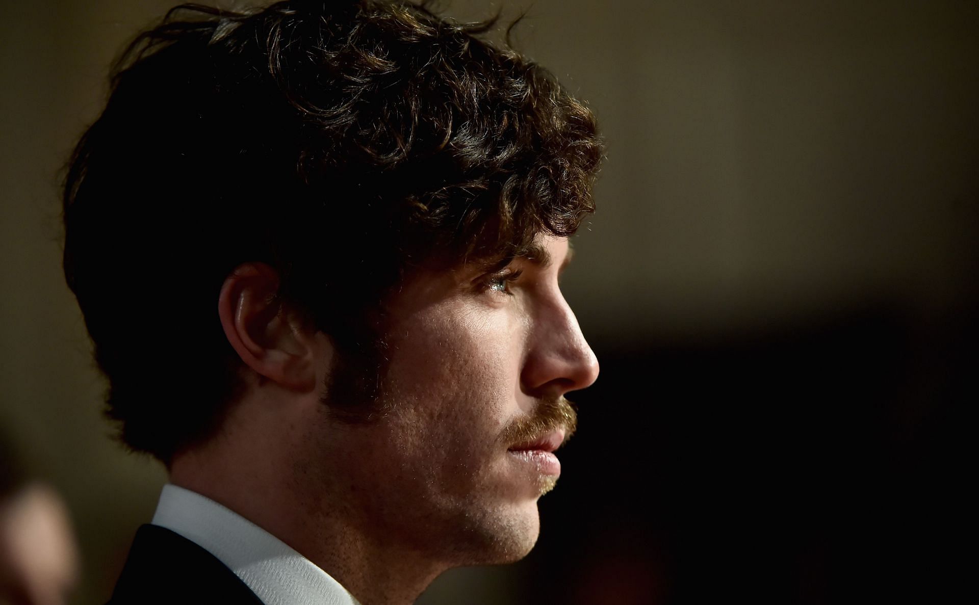 Tom Hughes plays Titus Flavianus (Image via Gareth Cattermole/Getty Images)