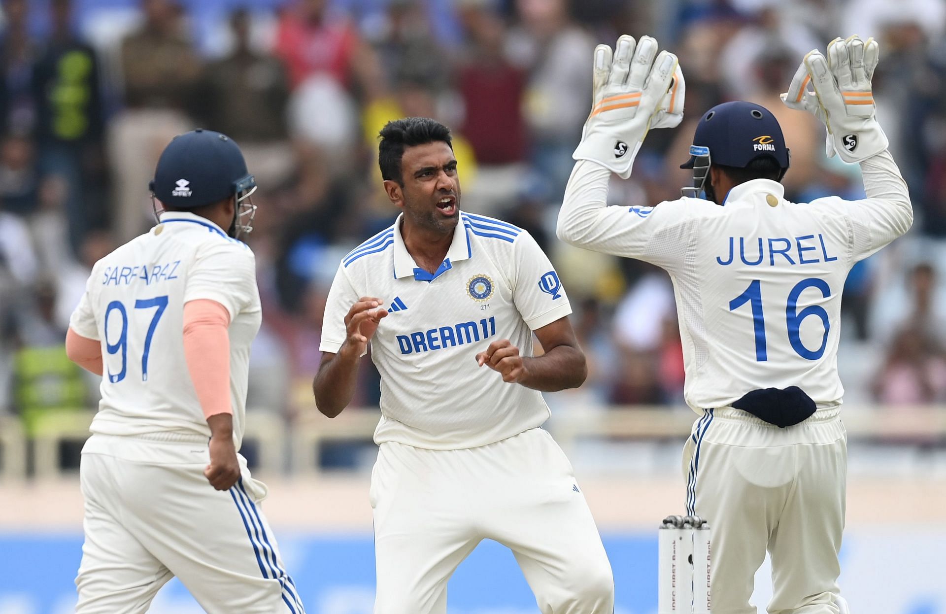 Ravichandran Ashwin (middle) celebrates a wicket with teammates. (Image Credits: Getty Images)