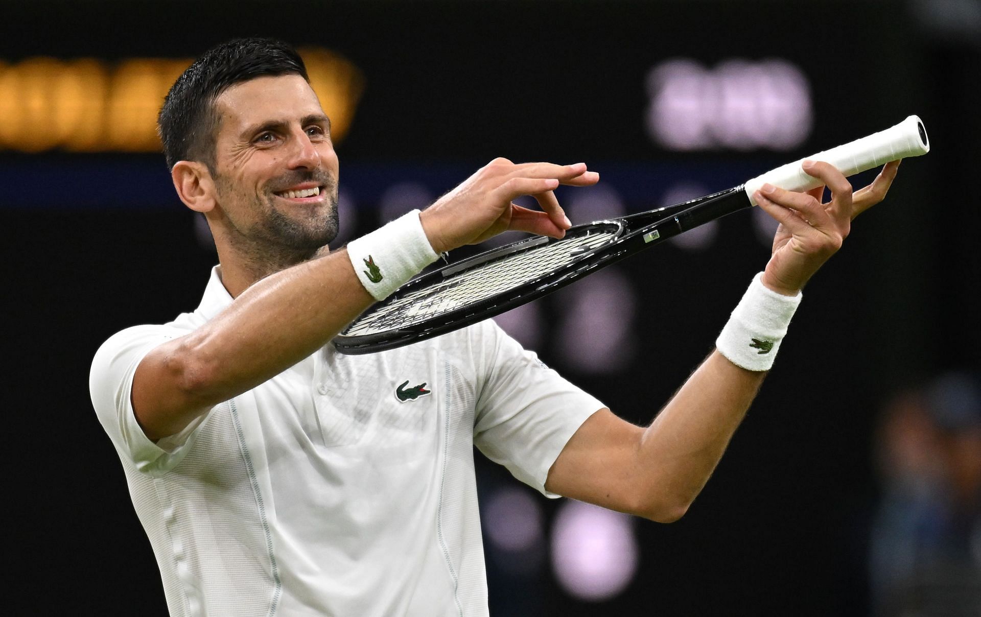 The seven-time Wimbledon champion celebrates after reaching the quarterfinals