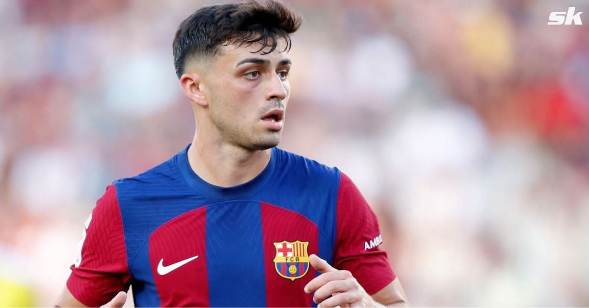 Barcelona midfielder Pedri looks on.
