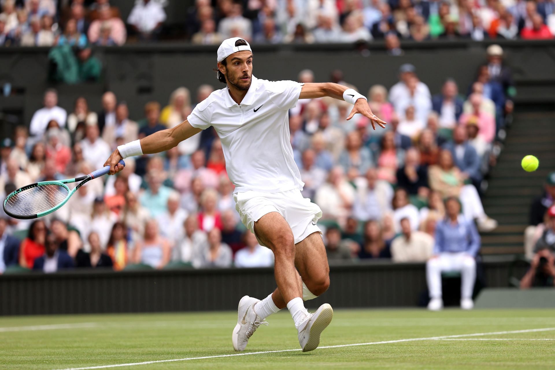 Lorenzo Musetti in action at Wimbledon 2024