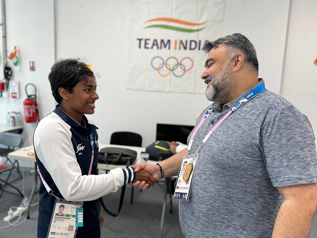 Gagan Narang welcoming swimmer Dhinidhi Desinghu at Paris 2024 Olympics (X@WeAreTeamIndia)