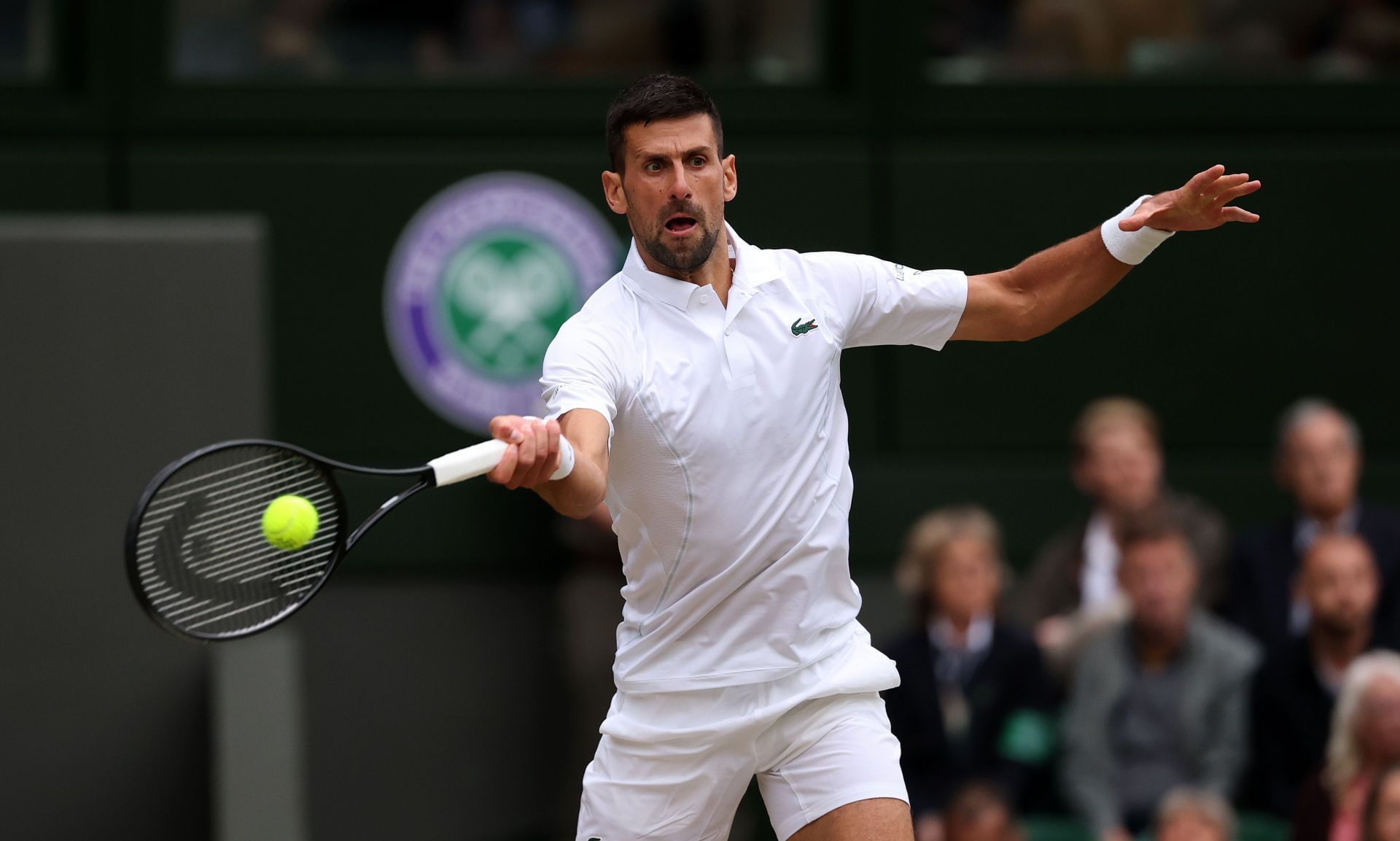 Novak Djokovic hits a forehand during the semifinals at Wimbledon