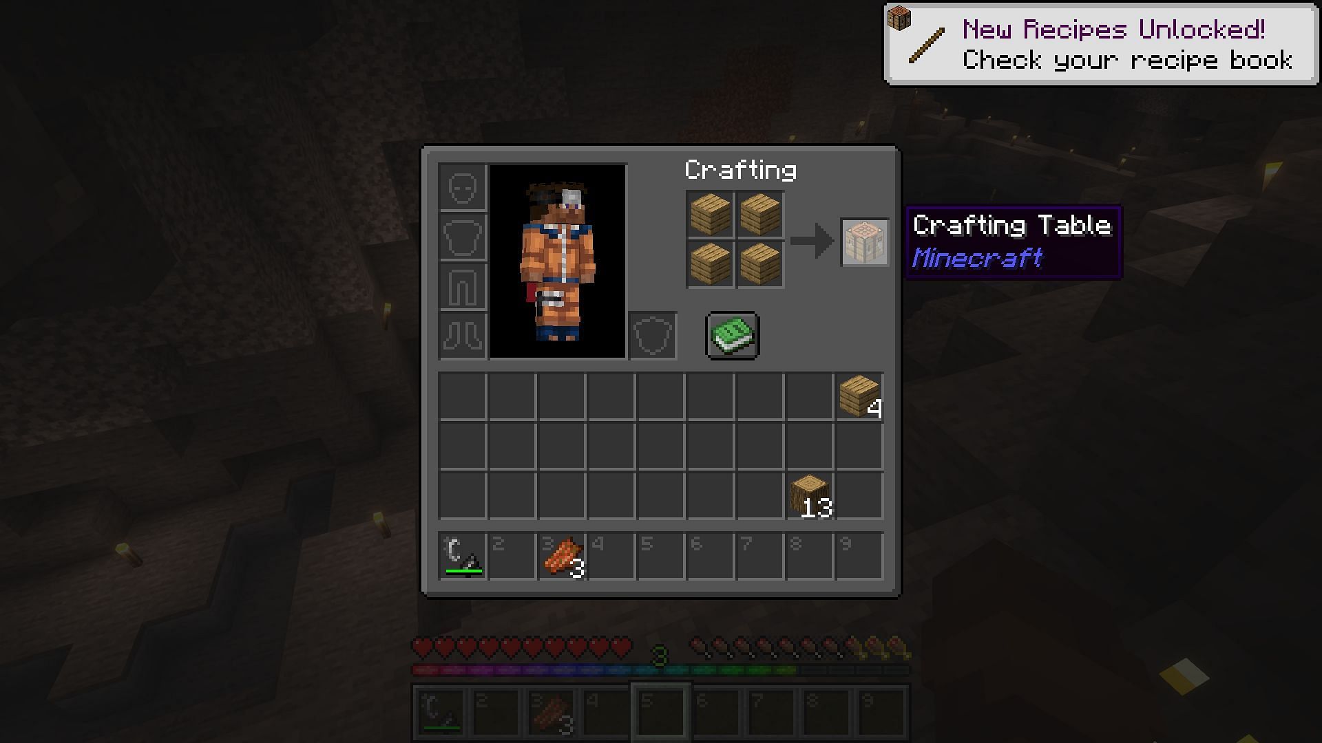 Using a backup supply of wood to make a crafting table in a cave (Image via Mojang)