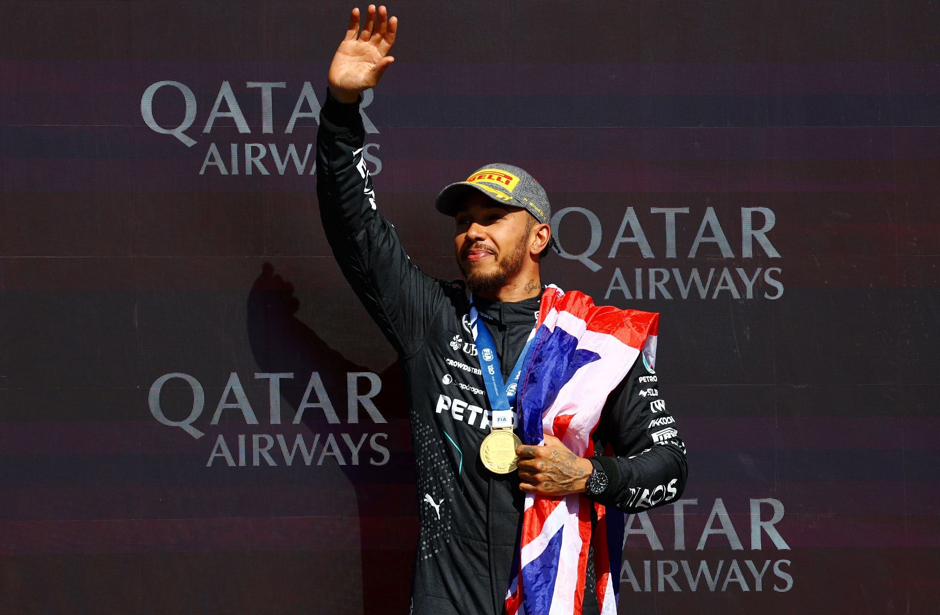 Race winner Lewis Hamilton of Great Britain and Mercedes celebrates on the podium during the F1 Grand Prix of Great Britain at Silverstone Circuit on July 07, 2024 in Northampton, England. (Photo by Mark Thompson/Getty Images)