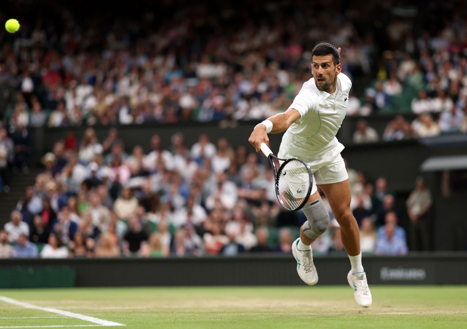 Novak Djokovic returns a ball at Wimbledon