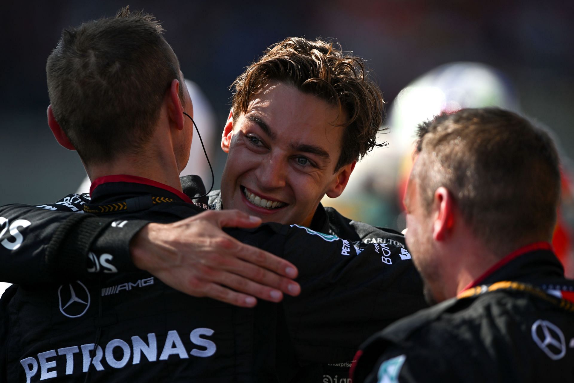 Original race winner (now disqualified) George Russell celebrates after the Belgian GP. (Image via Getty)