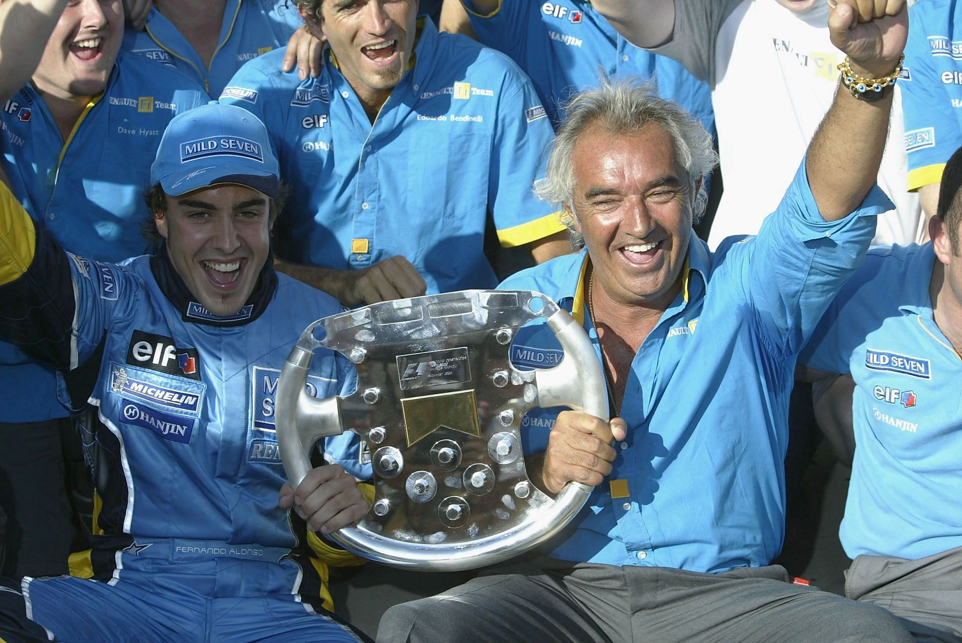 Fernando Alonso of Spain and Renault celebrate with Flavio Briatore and the Renault team after winning the Formula One Hungarian Grand Prix - Getty Images