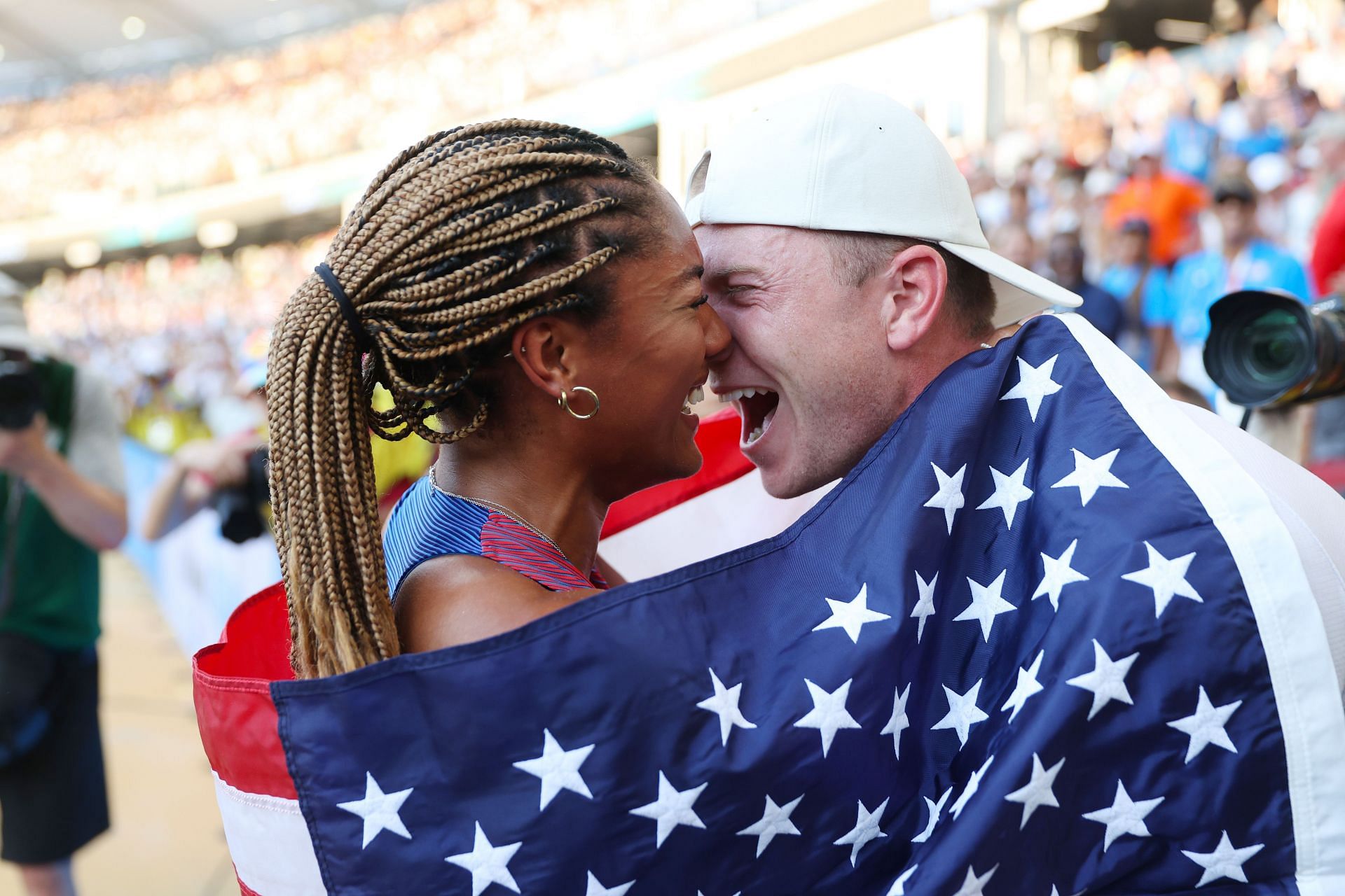 Tara Davis-Woodhall celebrates with Hunter Woodhall during the 2023 World Athletics Championships in Budapest, Hungary. (Source: Getty)