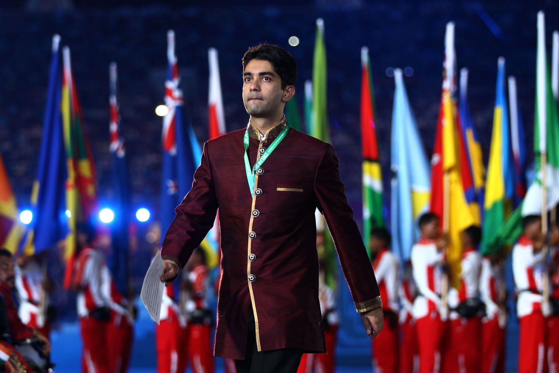 Abhinav Bindra of India walks towards the centre stage to deliver an oath on behalf of all the athletes during the Opening Ceremony for the Delhi 2010 Commonwealth Games at Jawaharlal Nehru Stadium on October 3, 2010 in Delhi, India. (Photo by Feng Li/Getty Images)