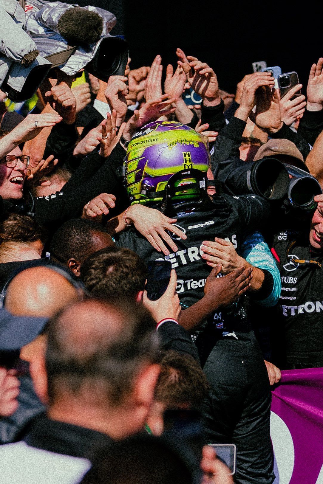 Lewis Hamilton celebrates with Mercedes teammates