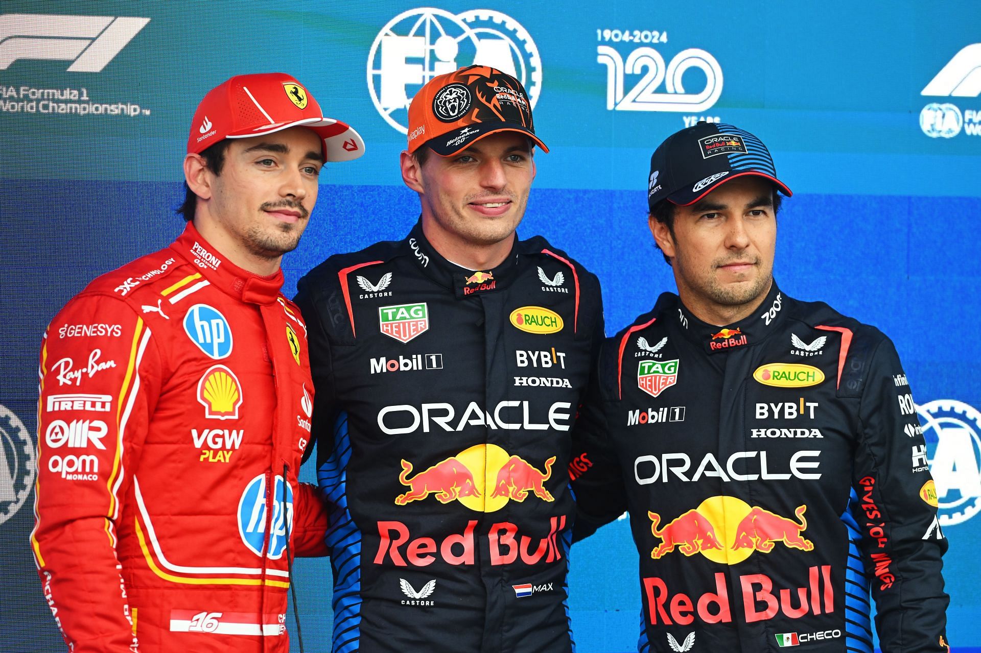 Max Verstappen, Charles Leclerc and Sergio Perez talk in parc ferme. (Image via Getty)