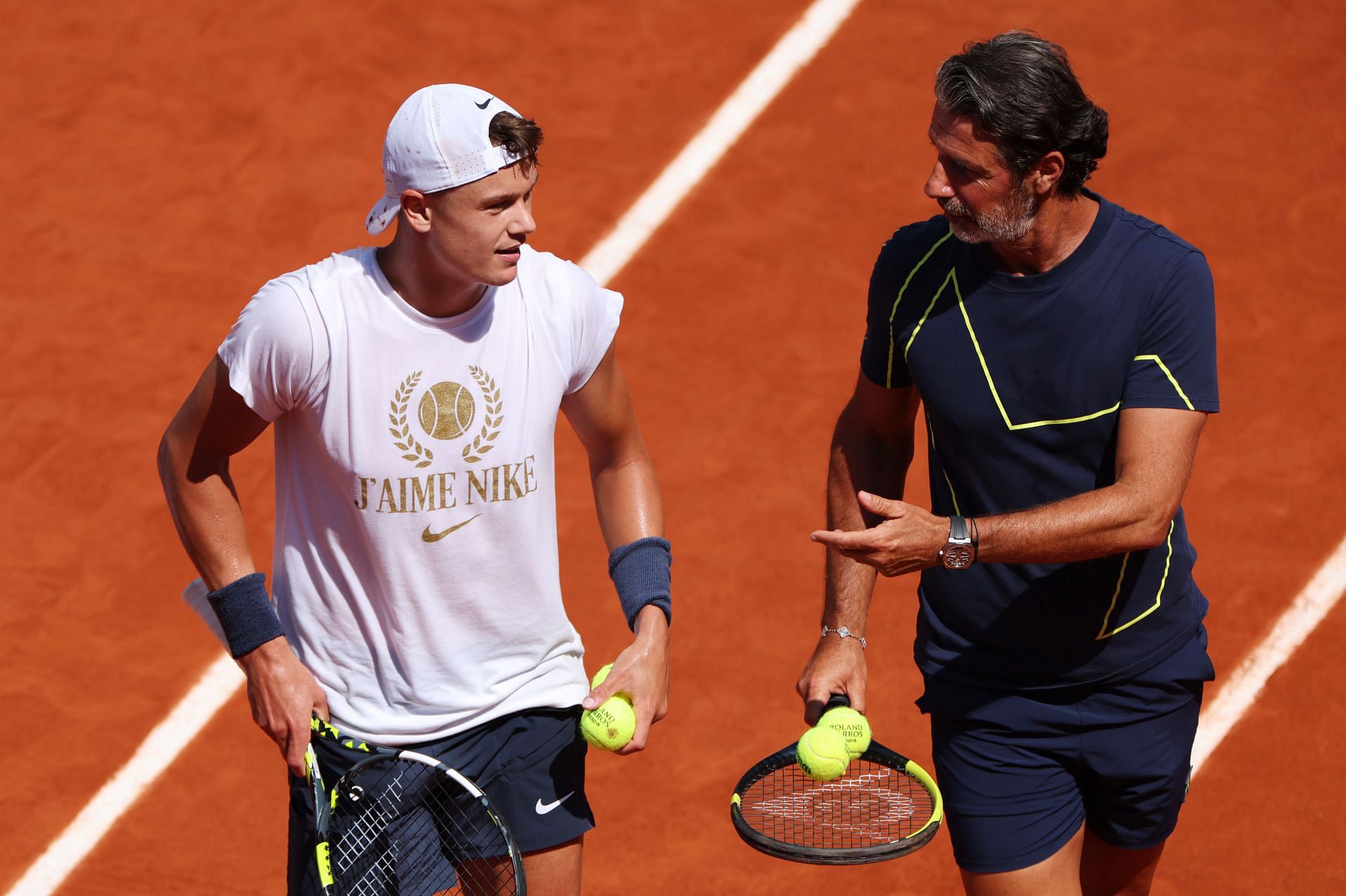 Holger Rune (L) with Patrick Mouratoglou. (Getty)