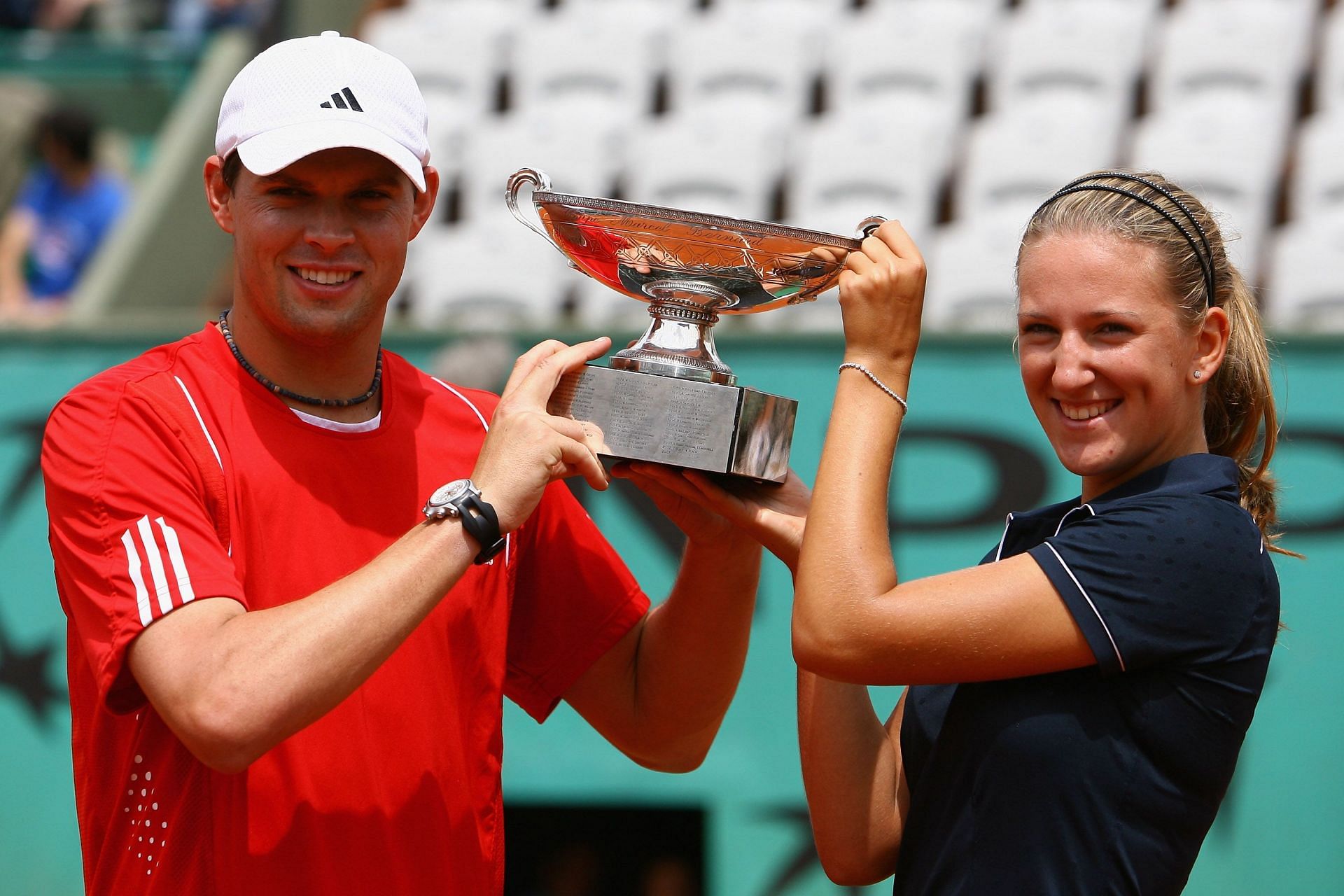 Victoria Azarenka (right) with Bob Bryan after winning the 2008 French Open - Mixed Doubles