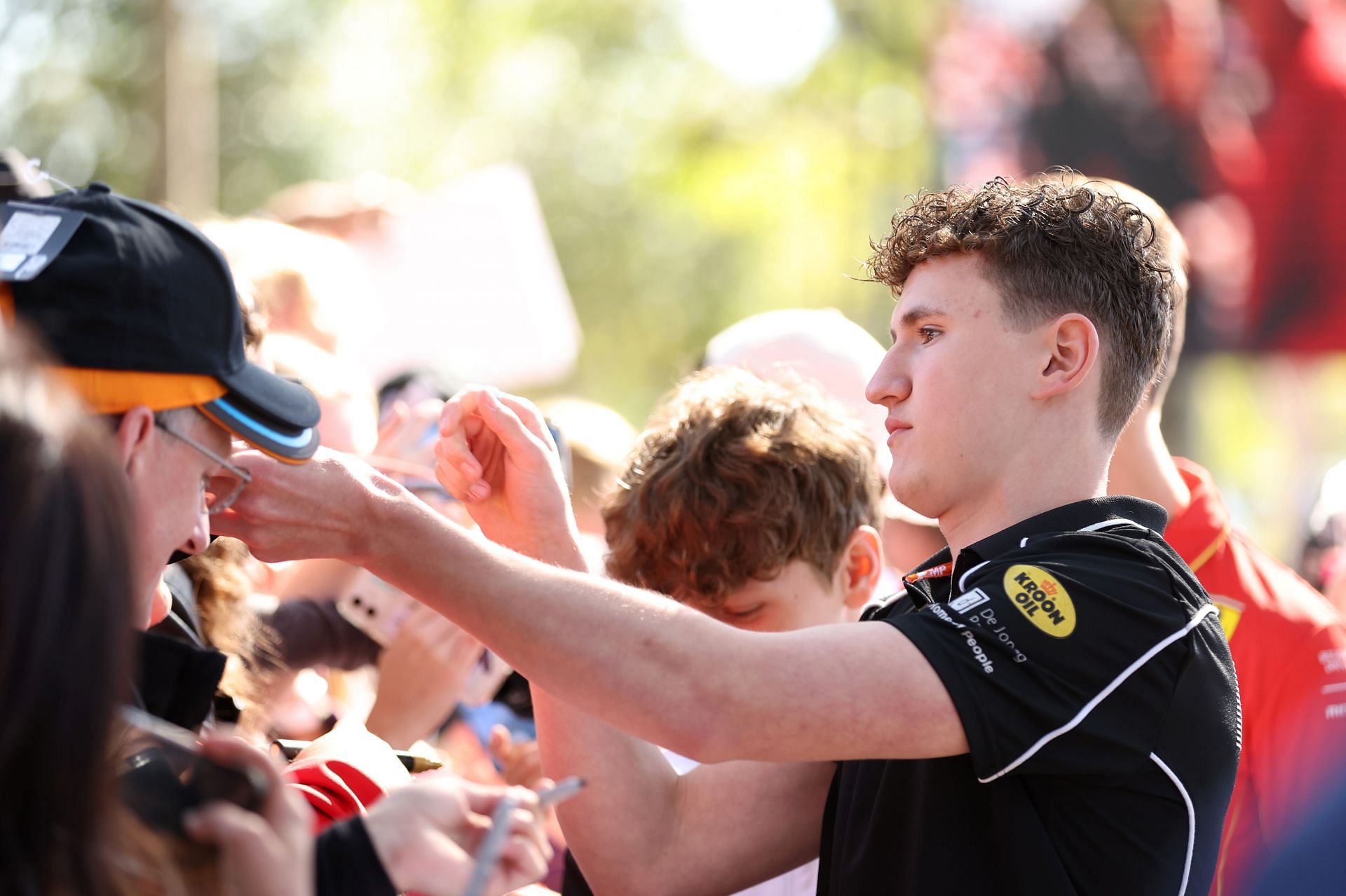 Alex Dunne of Ireland and MP Motorsport (9) greets fans on the Melbourne Walk during previews ahead of Round 2 Melbourne of the Formula 3 Championship at Albert Park Circuit on March 21, 2024 in Melbourne, Australia. (Photo by Robert Cianflone/Getty Images)