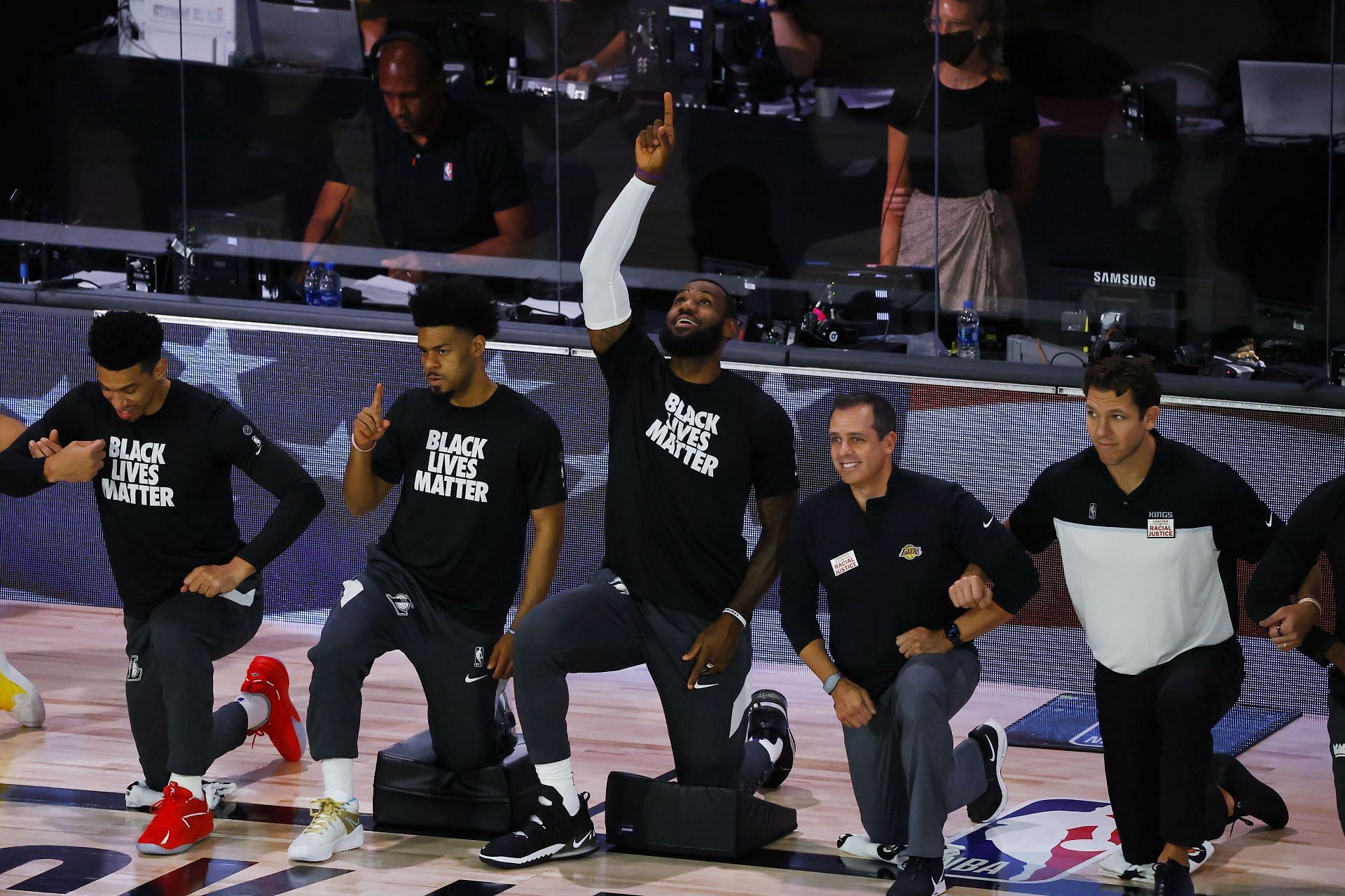 James kneeling during the anthem [Image Source: Getty]