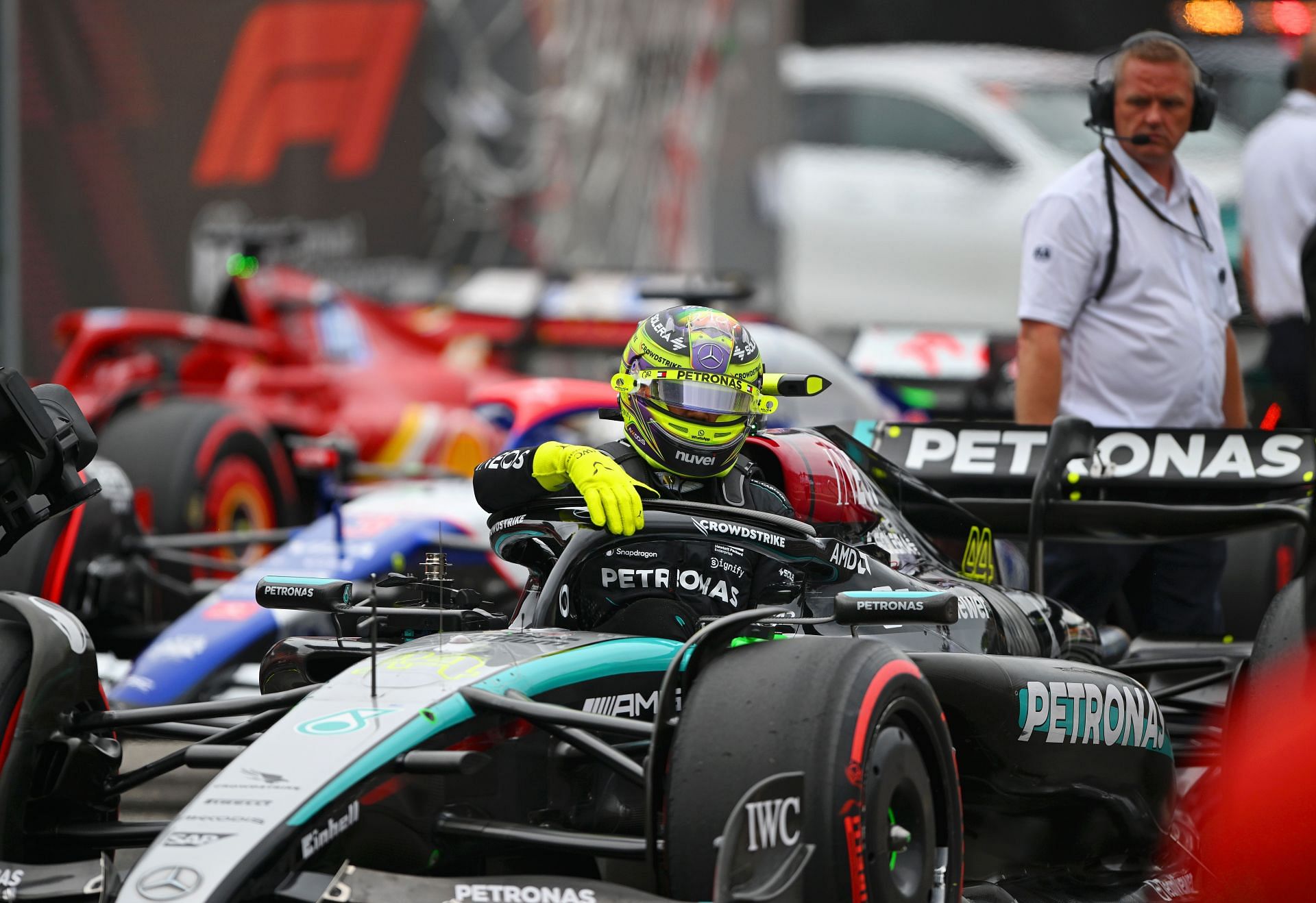 5th-placed qualifier Lewis Hamilton of Great Britain and Mercedes climbs from his car in parc ferme during qualifying ahead of the F1 Grand Prix of Hungary at Hungaroring on July 20, 2024, in Budapest, Hungary. (Photo by Rudy Carezzevoli/Getty Images)