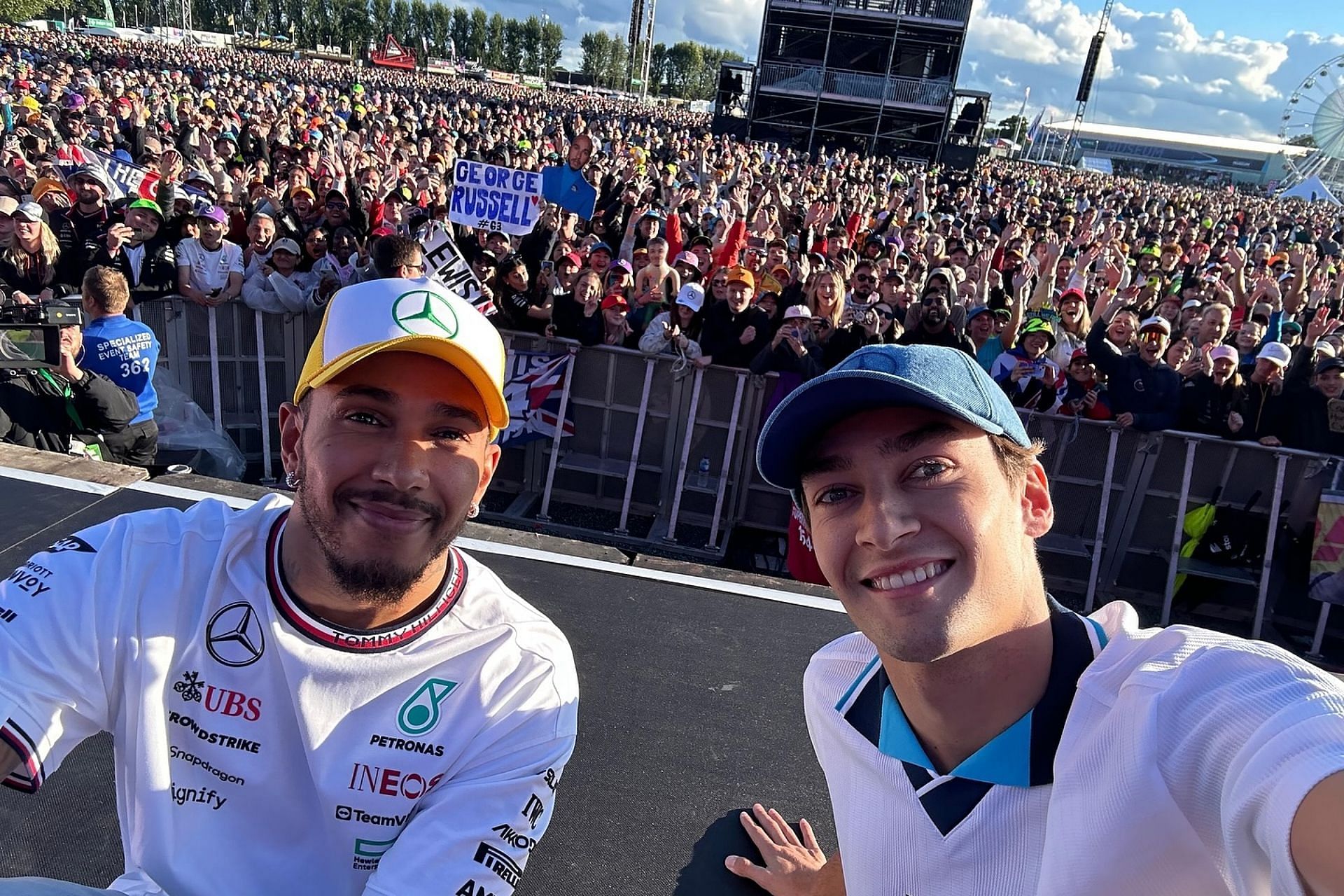 Lewis Hamilton and George Russell watching England vs Switzerland during a fan meeting session ahead of the 2024 F1 British GP (Image via Instagram/@georgerussell63)