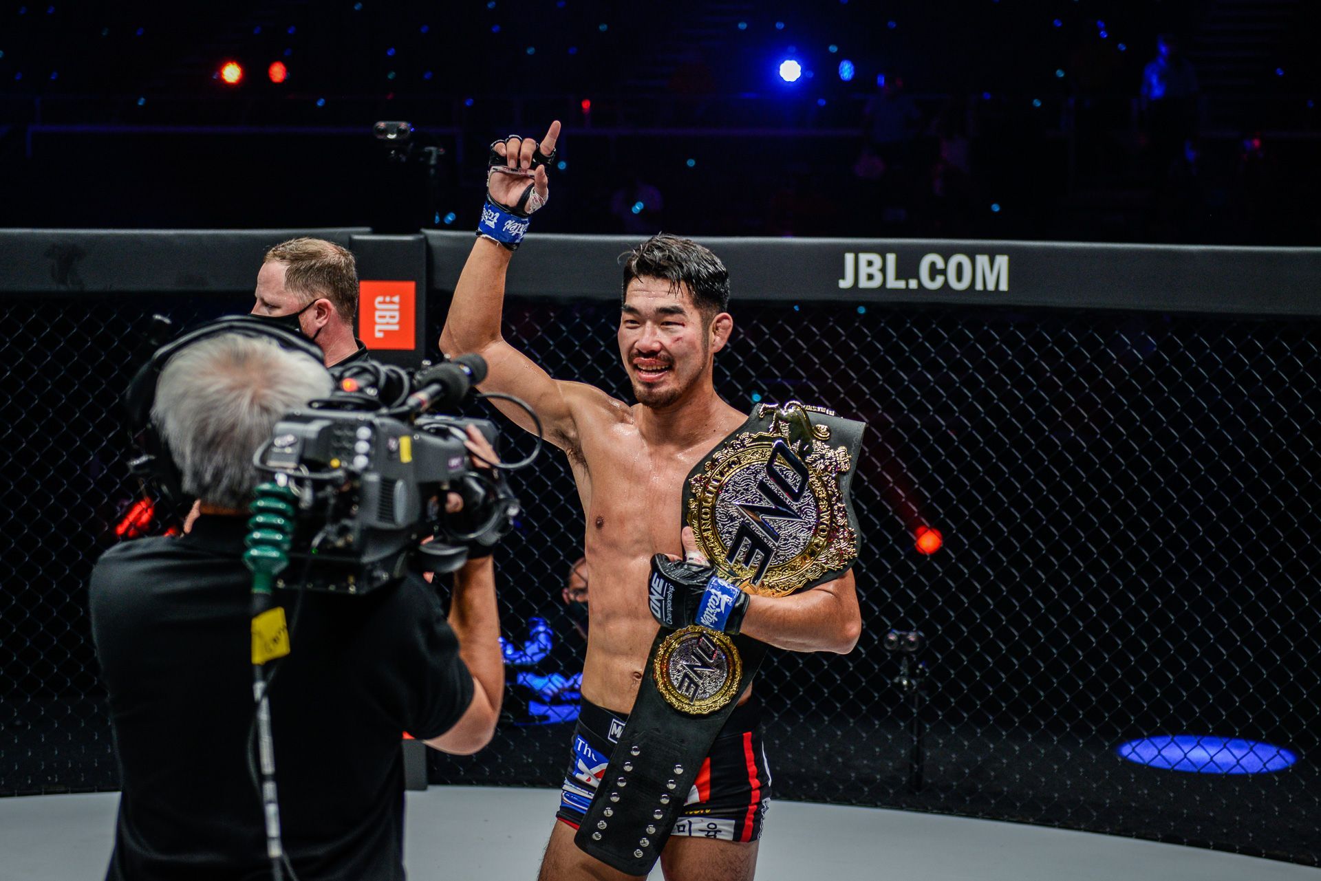 Ok Rae Yoon celebrates after beating Christian Lee to win the ONE lightweight MMA title in 2021.