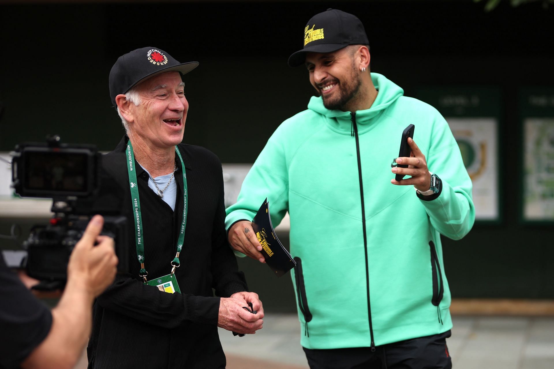 Nick Kyrgios walks Wimbledon grounds with John McEnroe