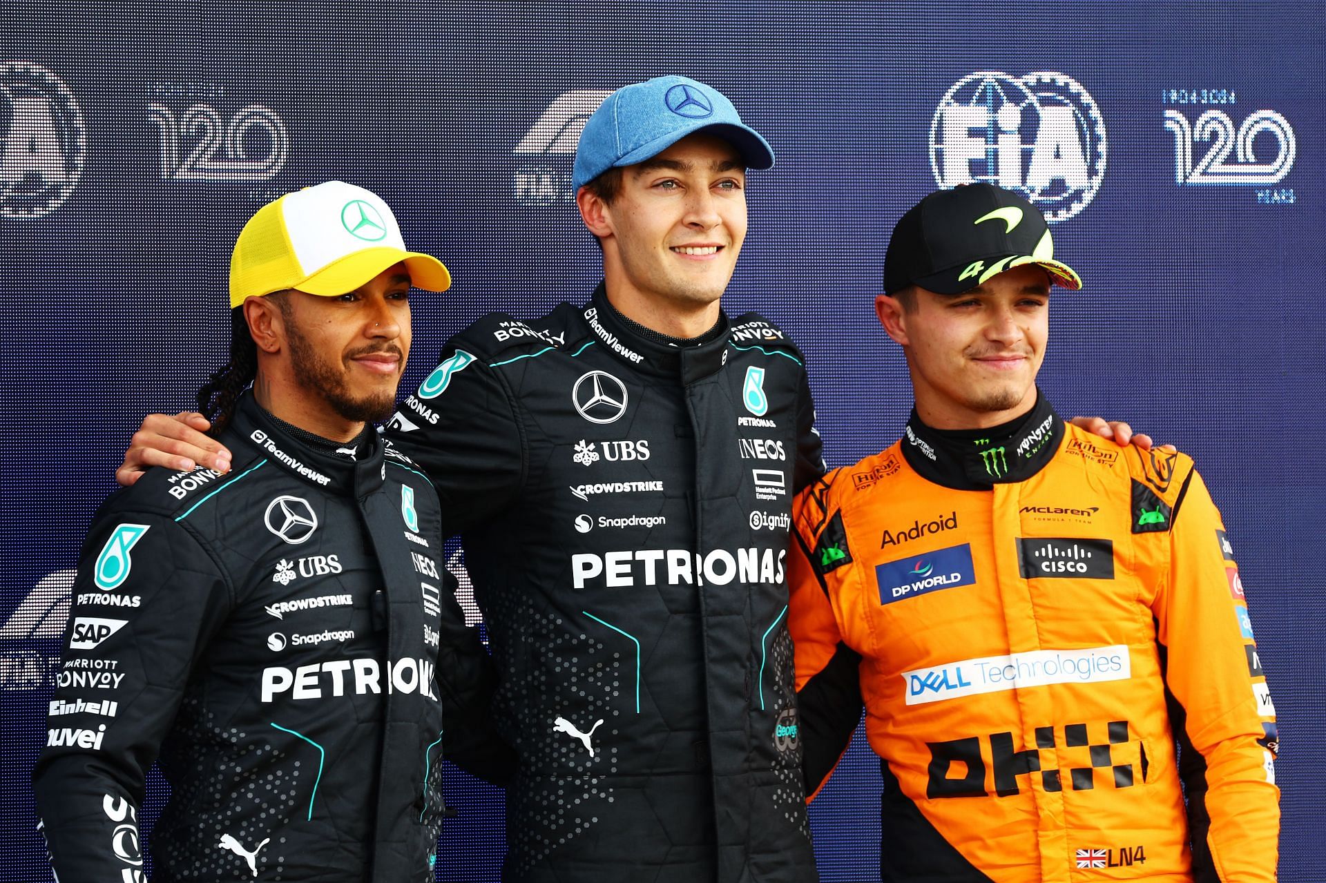 George Russell, Lewis Hamilton and Lando Norris of Great Britain and McLaren pose for a photo in parc ferme during qualifying ahead of the F1 Grand Prix of Great Britain at Silverstone Circuit on July 06, 2024 in Northampton, England. (Photo by Mark Thompson/Getty Images)