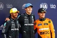 George Russell, Lewis Hamilton and Lando Norris of Great Britain and McLaren pose for a photo in parc ferme during qualifying ahead of the F1 Grand Prix of Great Britain at Silverstone Circuit on July 06, 2024 in Northampton, England. (Photo by Mark Thompson/Getty Images)