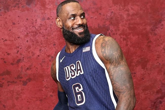 LeBron James beams with pride as he becomes first male basketball player to carry the USA flag at Paris Olympics Opening Ceremony