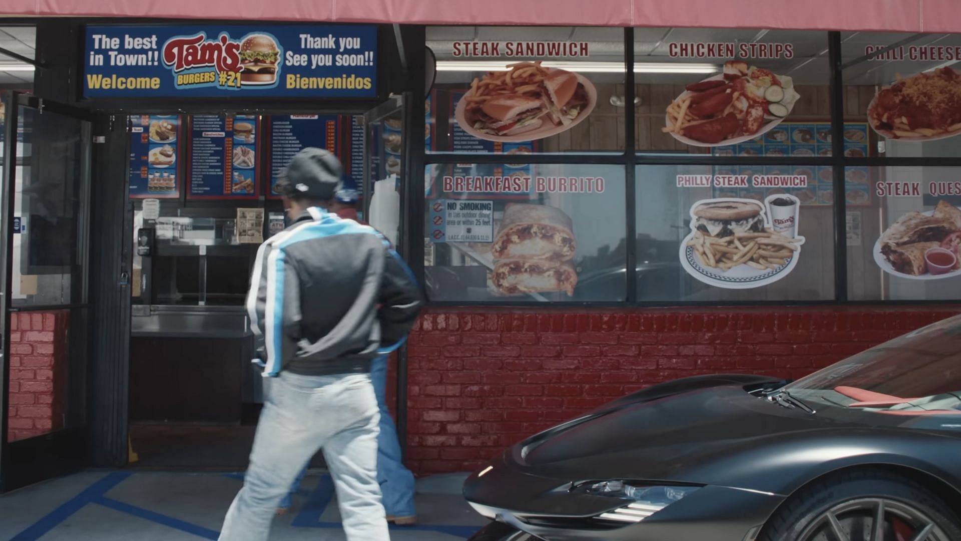 Kendrick Lamar visits &quot;Tam&#039;s Burgers&quot; with DJ Mustard in the music video for &#039;Not Like Us&#039; (Image via YouTube/@kendricklamar)