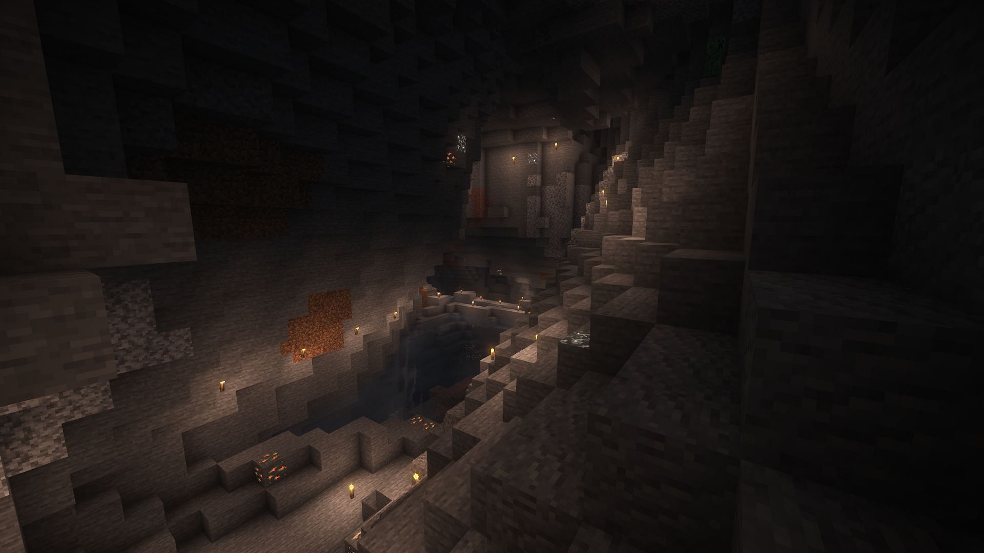 A cave lit up with torches (Image via Mojang)