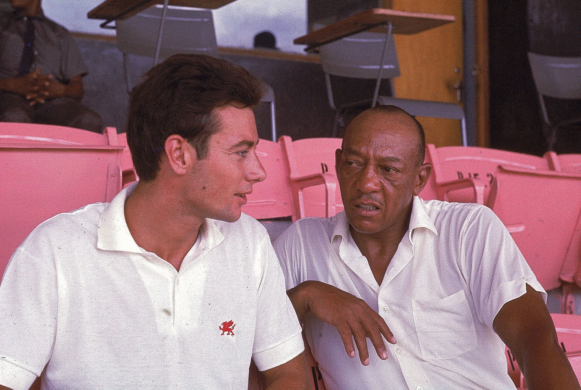 Jesse Owens (R) with Lynn Davies, another Olympic champion - Getty Images