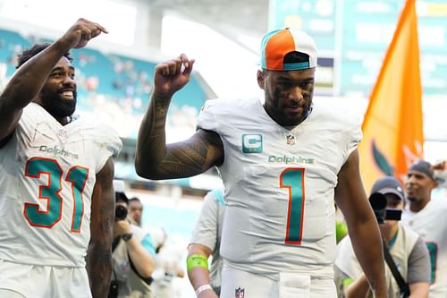 Raheem Mostert, left, Tua Tagovailo, right during Carolina Panthers v Miami Dolphins - Image Source: Getty