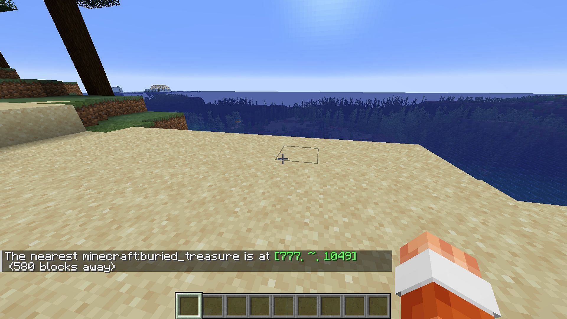 If you have cheats enabled in Minecraft, you can teleport to the nearest buried treasure and dig it up (Image via Mojang)