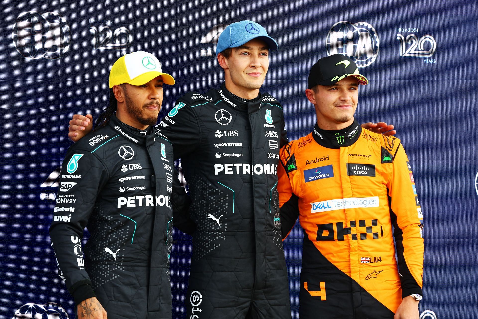 NORTHAMPTON, ENGLAND - JULY 06: Pole position qualifier George Russell of Great Britain and Mercedes, Second placed qualifier Lewis Hamilton of Great Britain and Mercedes and Third placed qualifier Lando Norris of Great Britain and McLaren pose for a photo in parc ferme. Courtesy: Getty Images