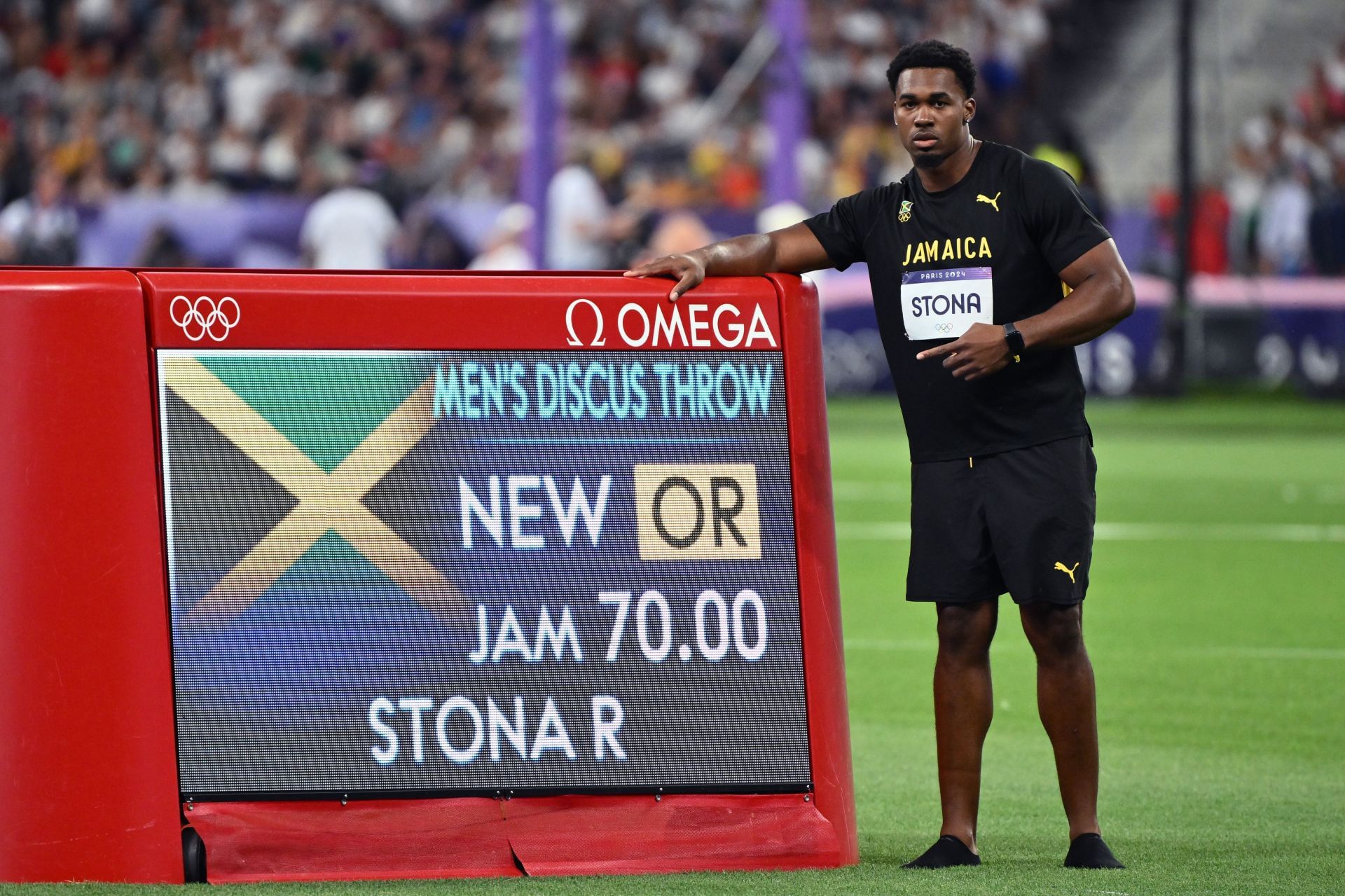 Roje Stona of Jamaica after breaking the Olympic record in the men's Discus Throw at the Paris Olympics 2024