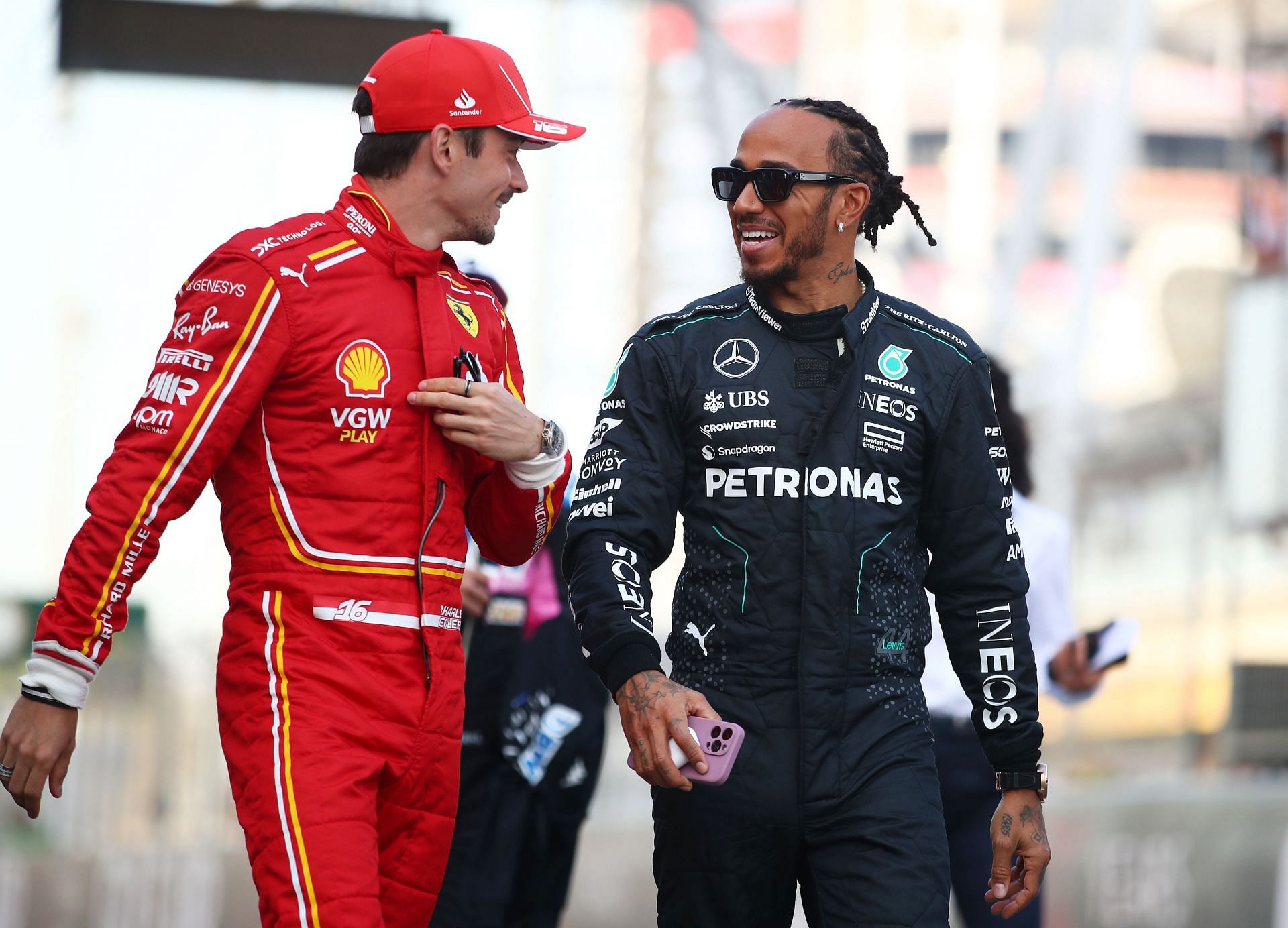 Lewis Hamilton and Charles Leclerc talk prior to the F1 Grand Prix of Bahrain at Bahrain International Circuit in 2024 (Photo by Joe Portlock - Formula 1/Formula 1 via Getty Images)