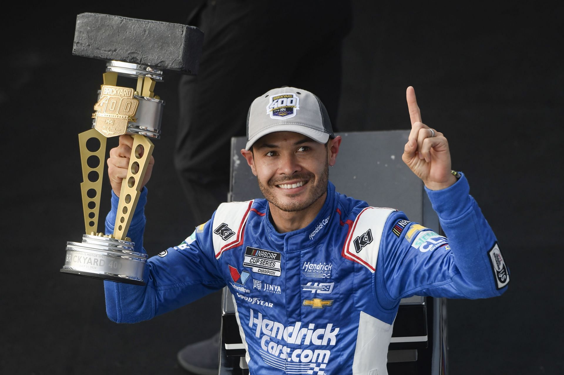 Kyle Larson (5 Hendrick Motorsports HendrickCars.com Chevrolet) holds up a brick trophy in victory lane after winning the NASCAR Cup Series Brickyard 400 - Source: Getty Images.