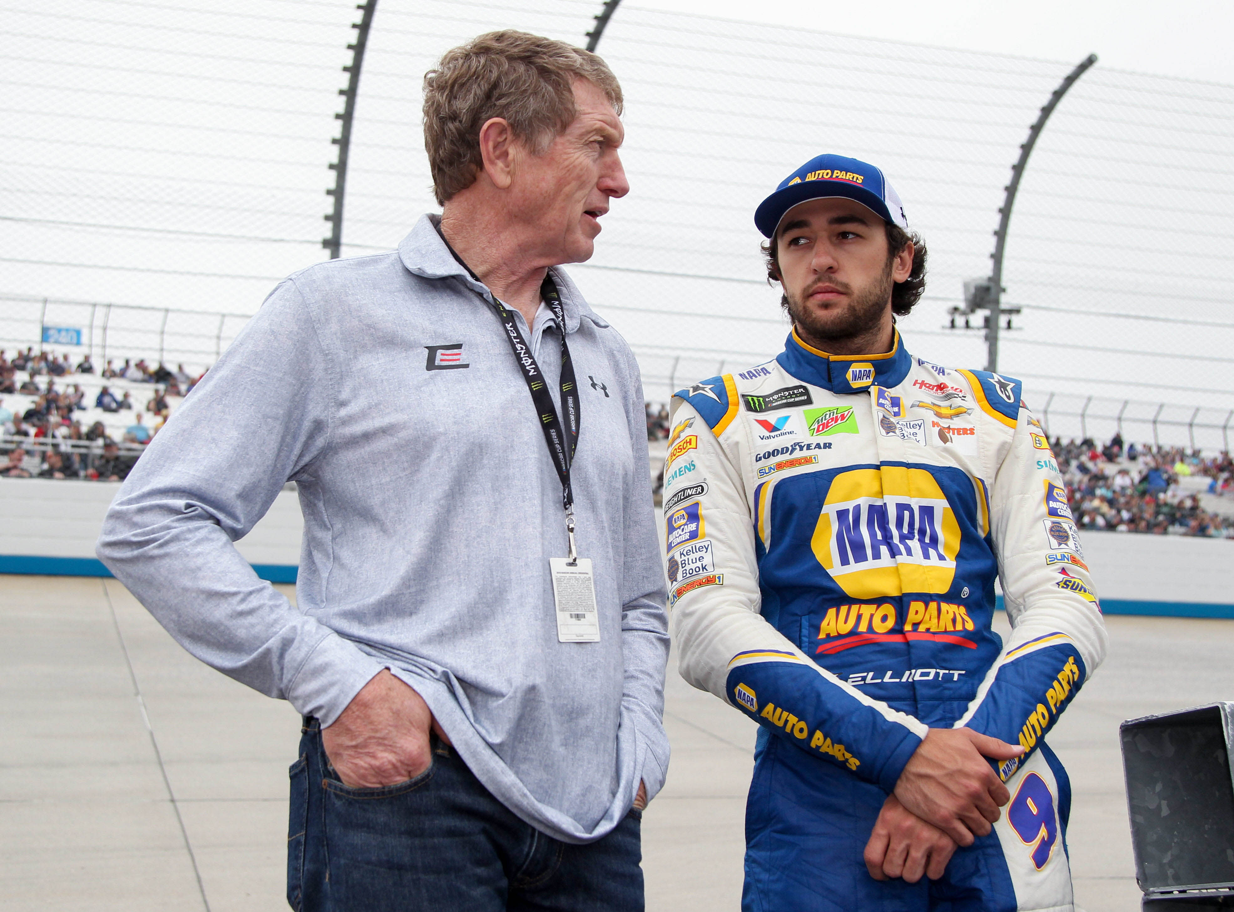 Chase Elliott (right) stands with his father Bill Elliott (left) prior to the AAA Drive for Autism at Dover International Speedway. Source: Imagn