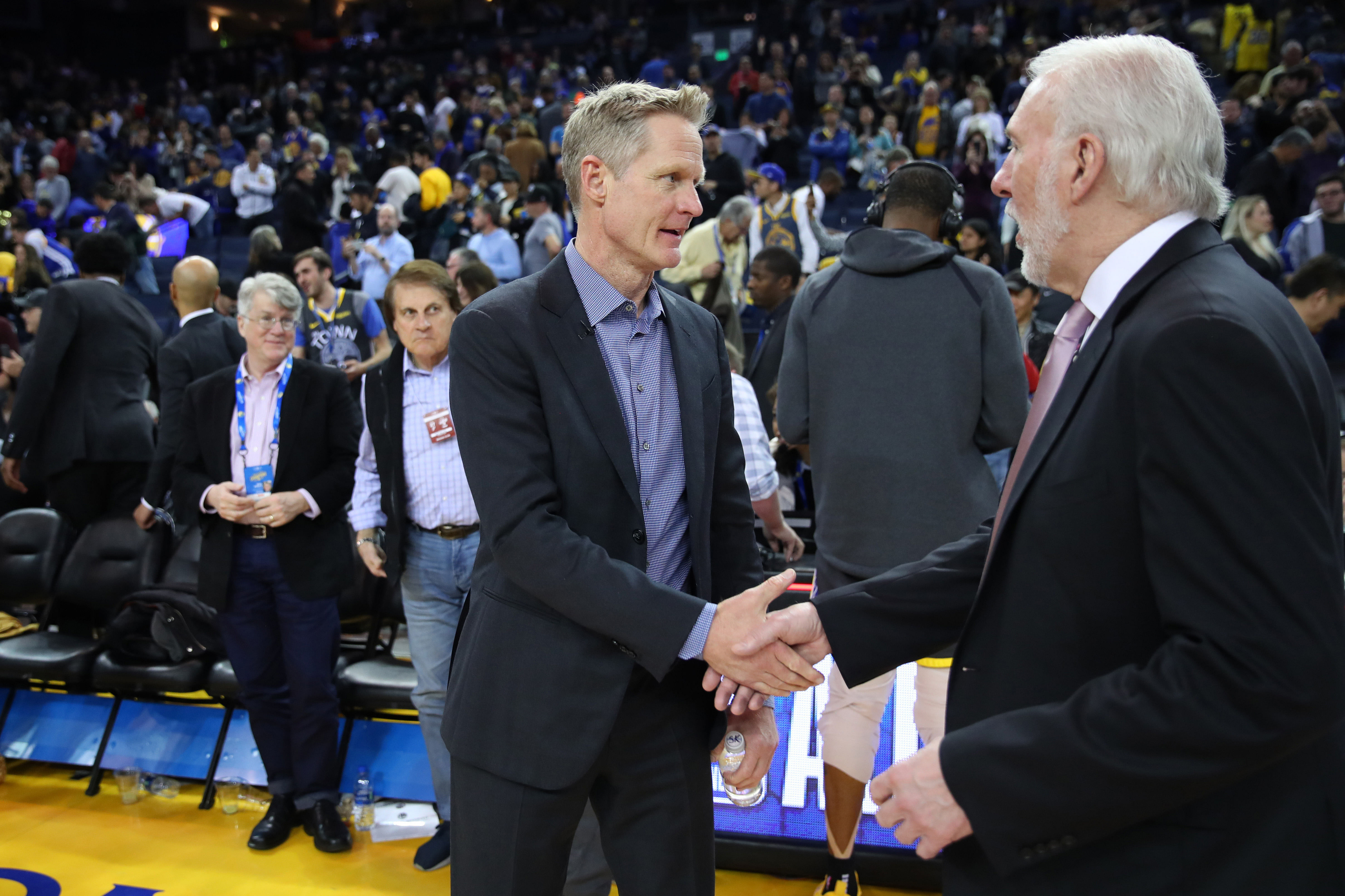 Golden State Warriors head coach Steve Kerr shakes hands with San Antonio Spurs head coach Gregg Popovich at Oracle Arena. Photo Credit: Imagn