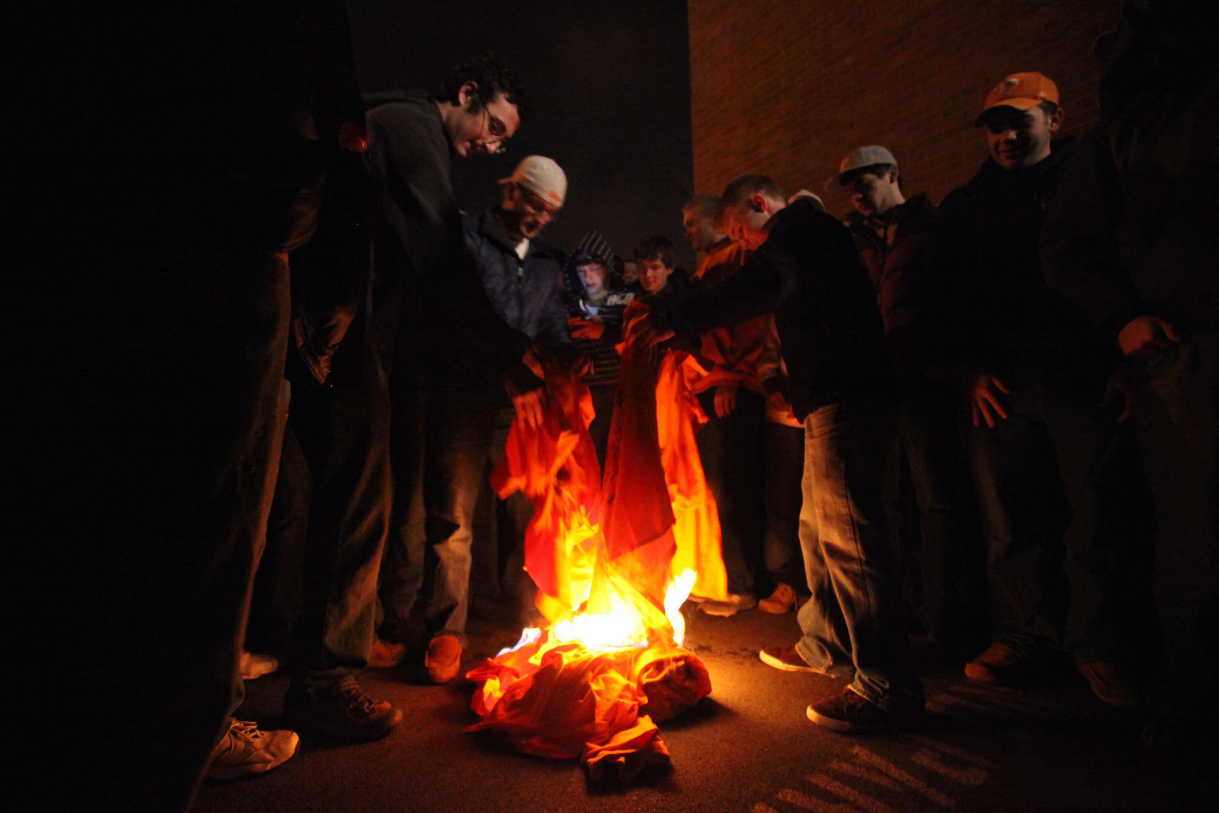 In a Jan. 12, 2010, photograph, students burn Lane Kiffin t-shirts after Kiffin announced his resignation as coach of the University of Tennessee football team. - Source: Imagn