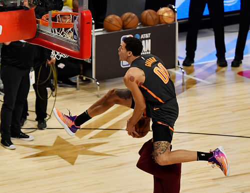 Orlando Magic player Aaron Gordon dunks over Chance the Rapper in the slam dunk contest during NBA All-Star Saturday Night at United Center (Credits: IMAGN)